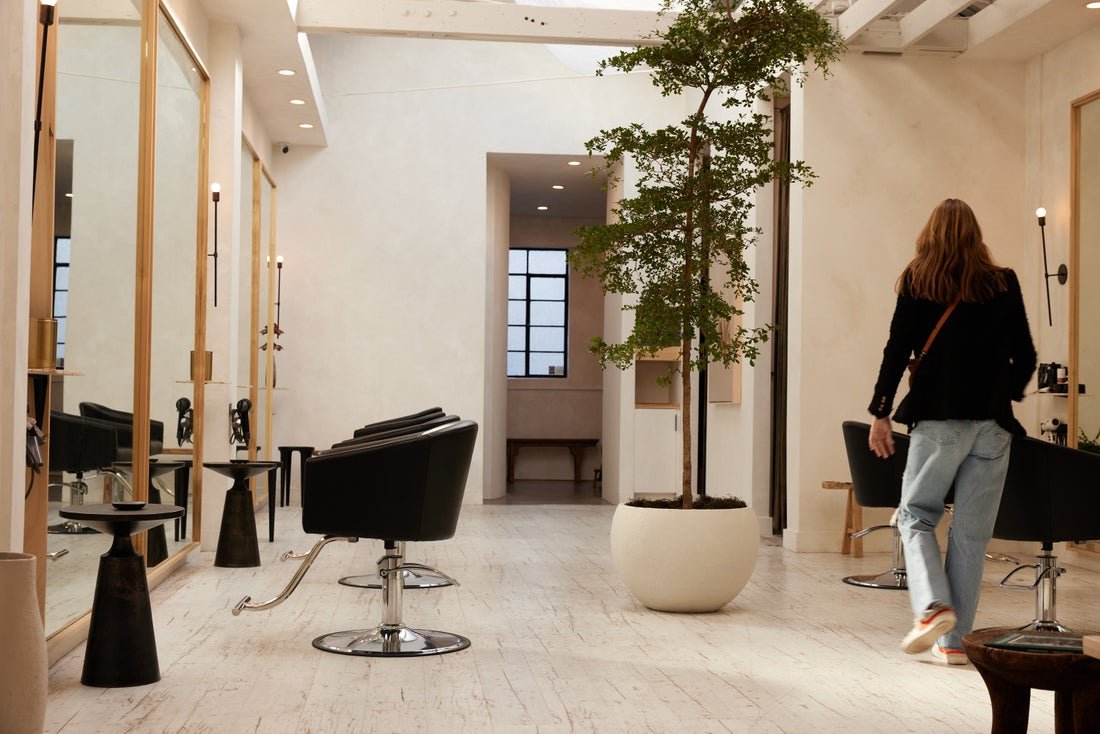 A salon owner walks through her business before her clients arrive.