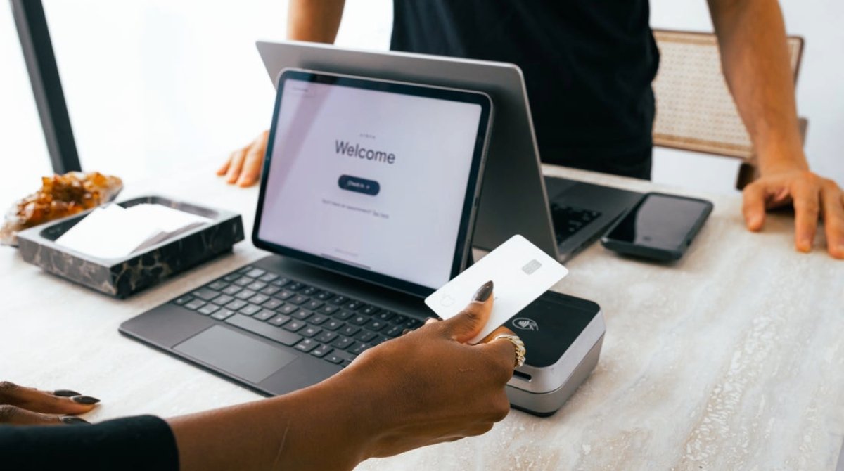 A client checks out at the point-of-sale of a self-care business.